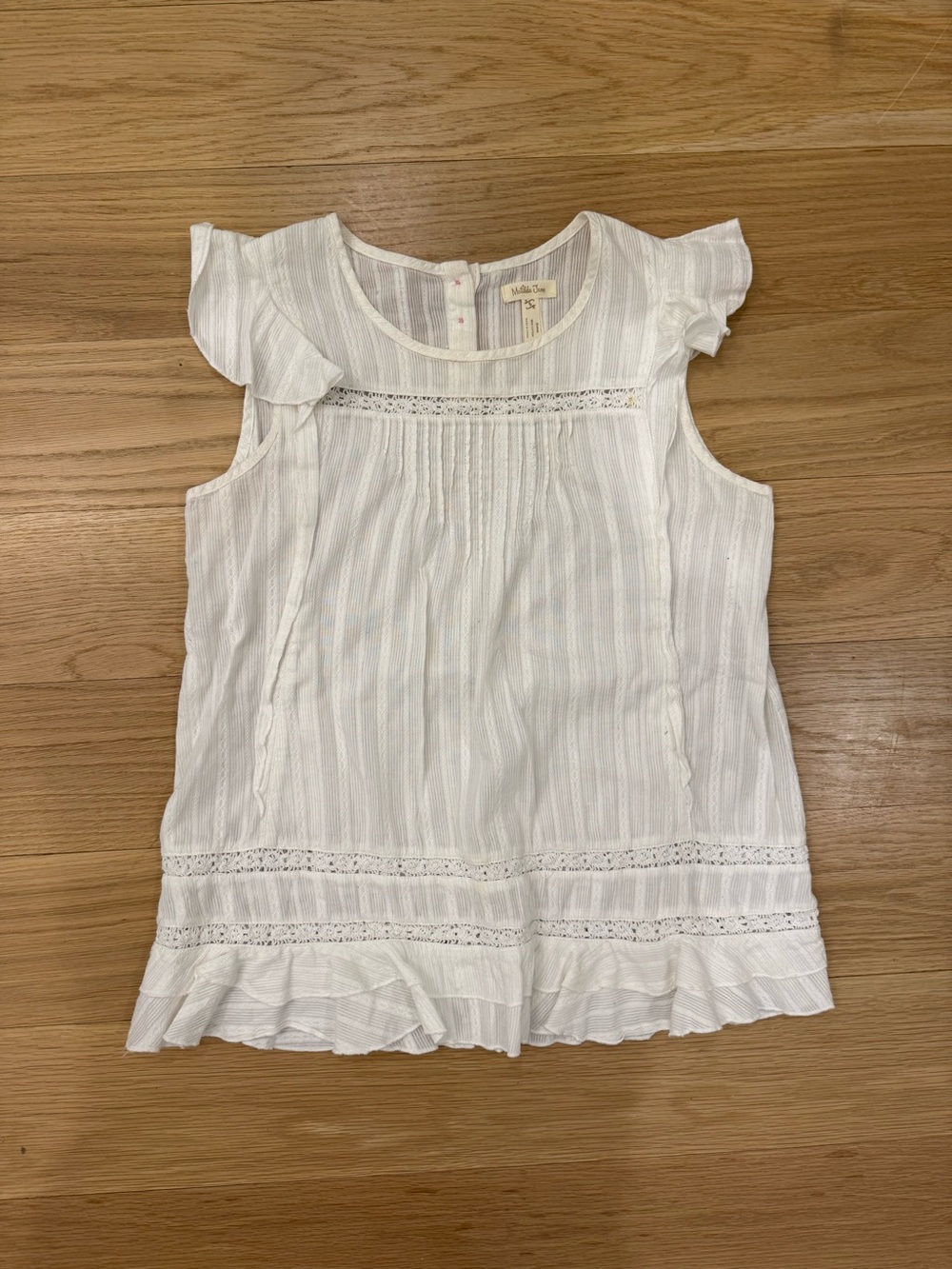 White Ruffled Sleeveless Blouse with Lace Trim
